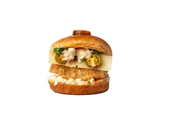 Crunchy chicken burger with bacon and fresh toppings